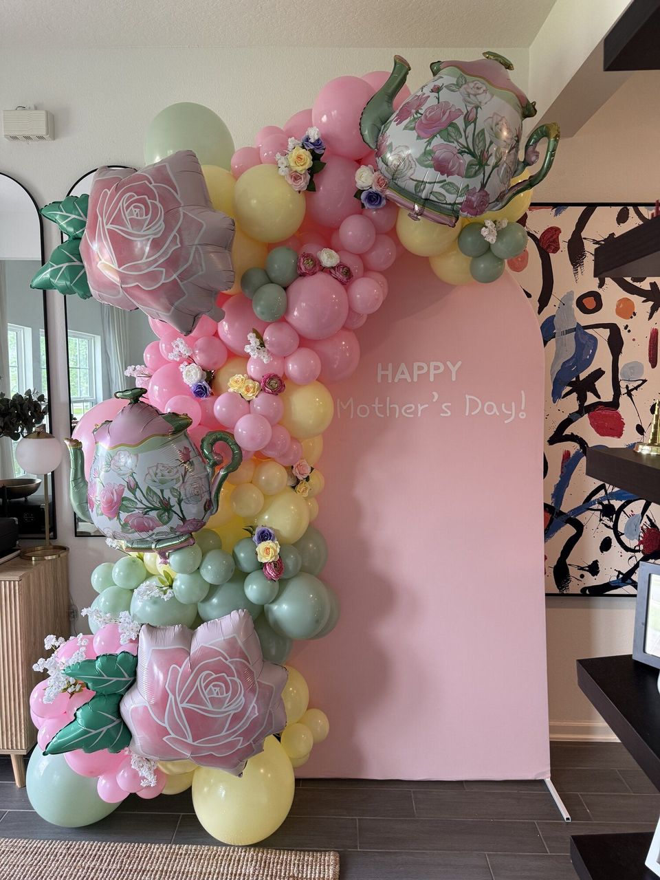 Floral balloon backdrop for a Mother's Day party